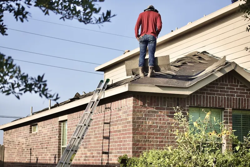 Professional roofer working on a residential roof in Traditions Golf Club Community